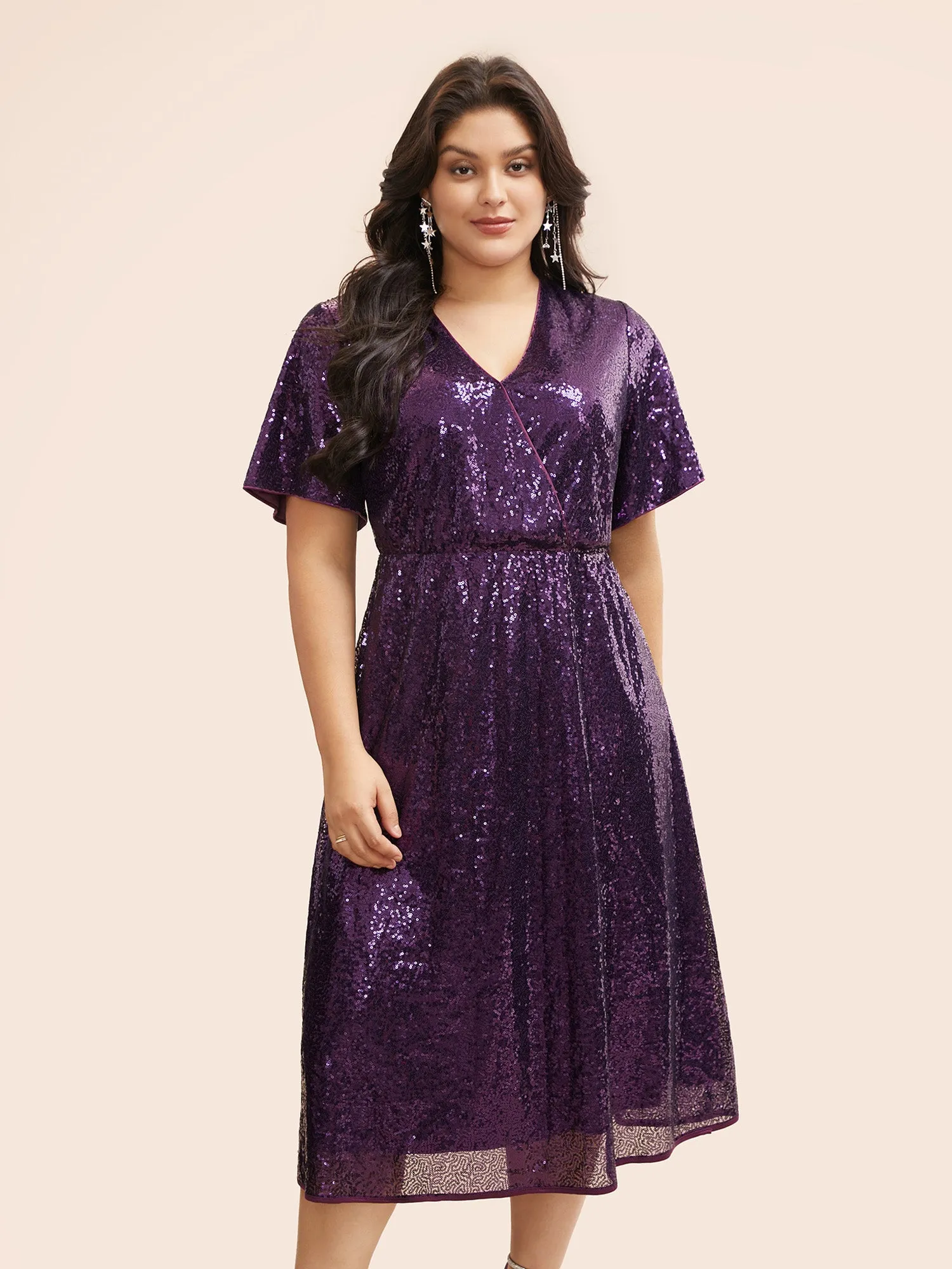 Sequin Overlap Collar Ruffle Sleeve Dress sold by Bloomchic