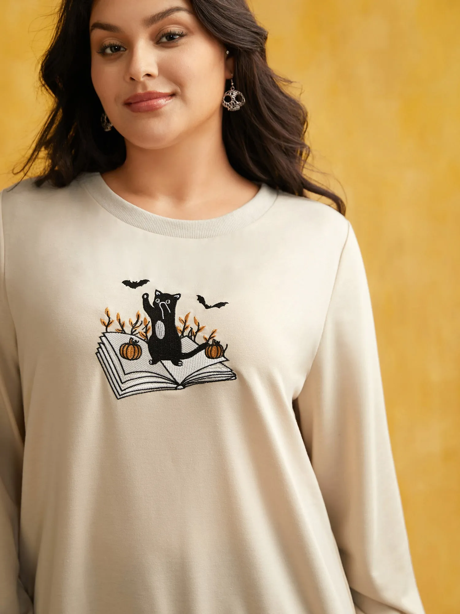 Cat-in-the-book Embroidered Sweatshirt sold by Bloomchic