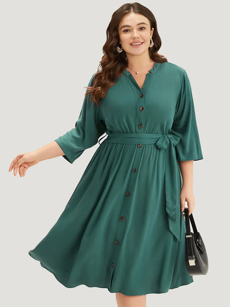 Solid Button Detail Pocket Belted Notched Dress sold by Bloomchic