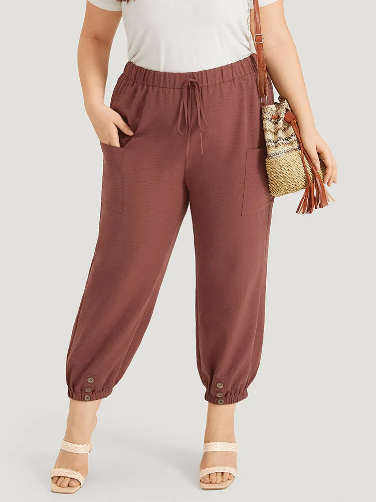 Solid Patched Pocket Bowknot Button Detail Pants sold by Bloomchic