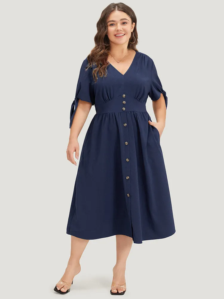 Plain Pocket Button Detail V Neck Plicated Knot Dress sold by Bloomchic