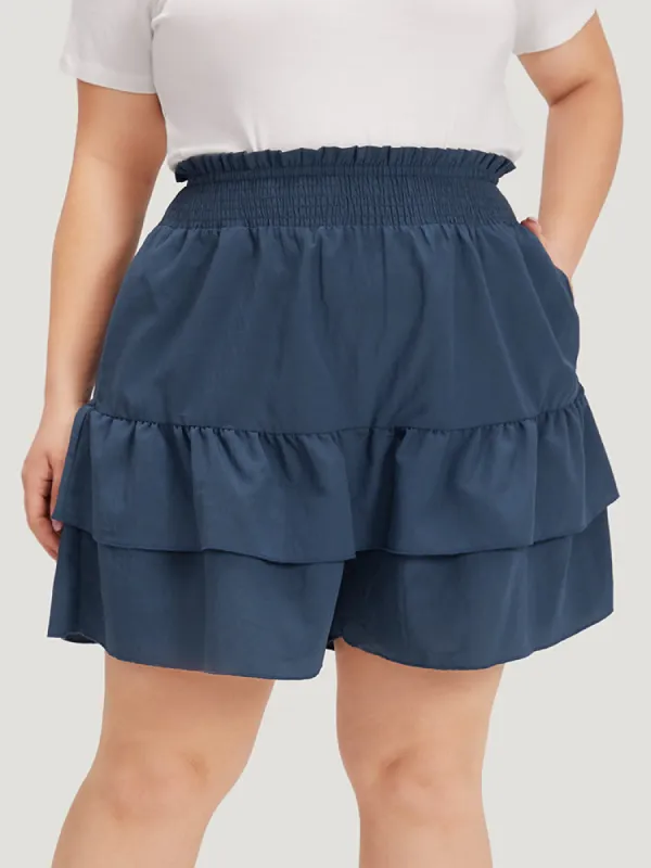 Solid Paperbag Waist Shirred Layered Hem Shorts sold by Bloomchic