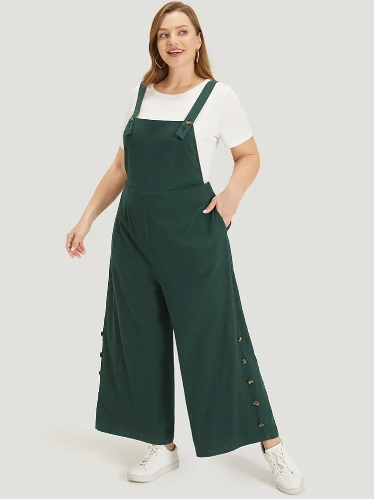 Solid Button Detail Pocket Adjustable Straps Cami Jumpsuit sold by Bloomchic