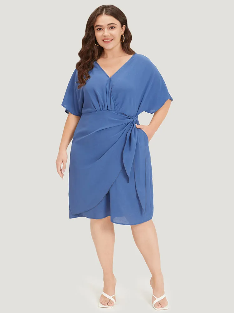 Solid Surplice Neck Gathered Twist Front Batwing Sleeve Dress sold by Bloomchic