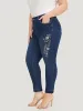 Very Stretchy Floral Embroidered Dark Wash Jeans sold by Bloomchic