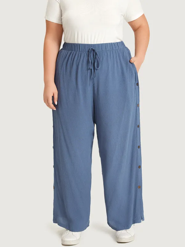 Plain Pocket Split Hem Ties Button Detail Pants sold by Bloomchic