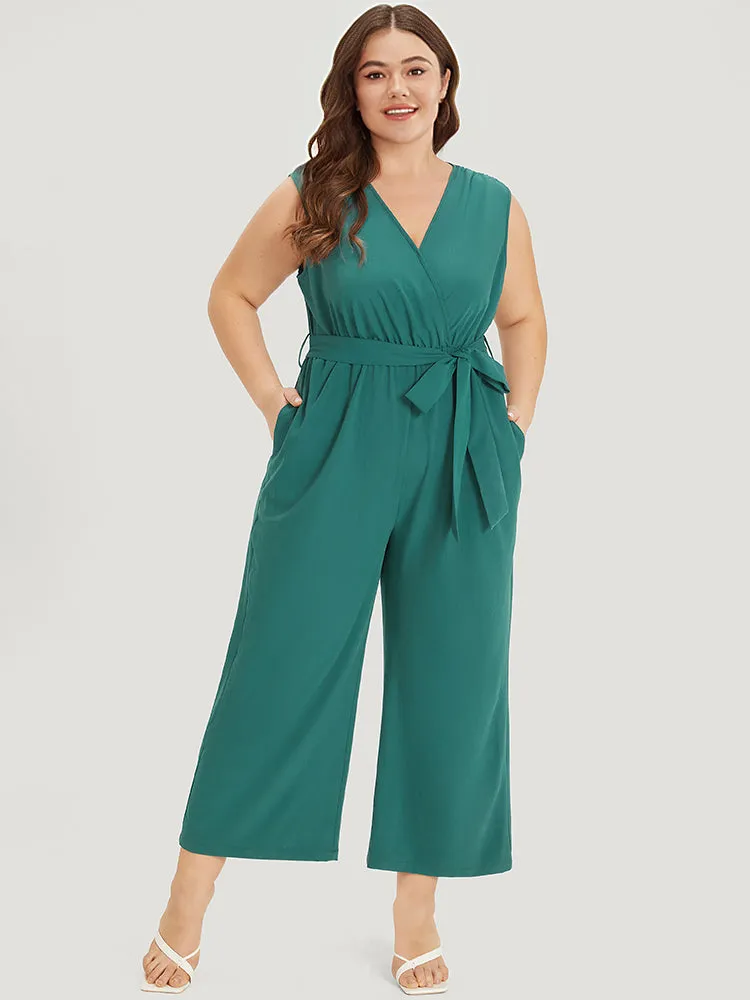 Supersoft Essentials Plain Surplice Neck Belted Jumpsuit sold by Bloomchic