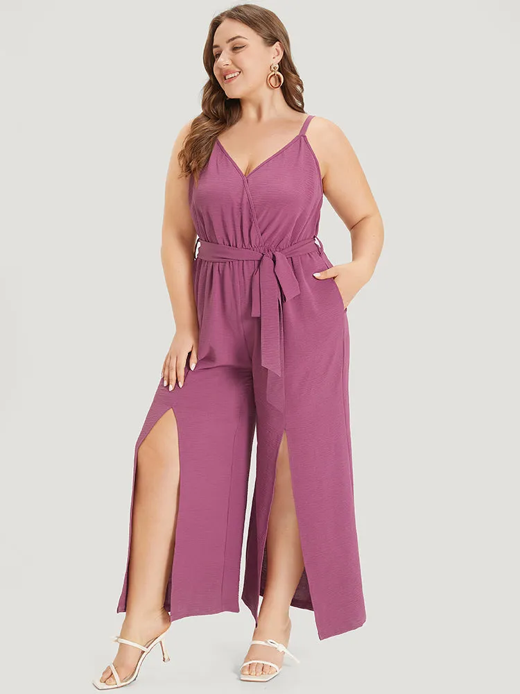 Plain Split Front Pocket Surplice Neck Belted Jumpsuit sold by Bloomchic