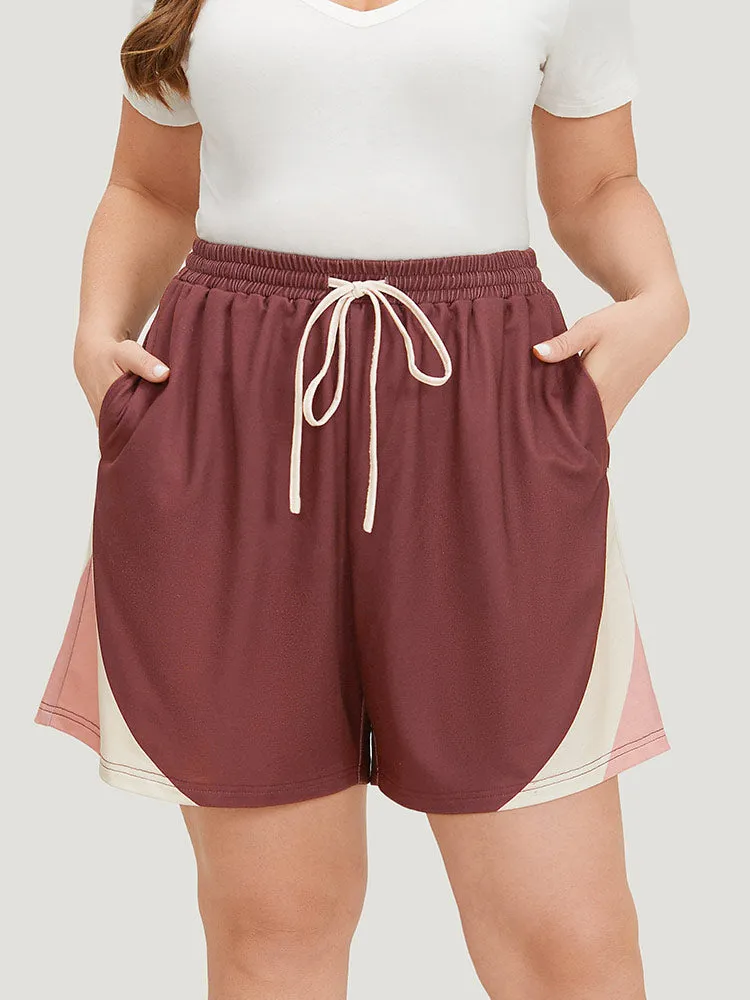 Contrast Pocket Drawstring Elastic Waist Shorts sold by Bloomchic