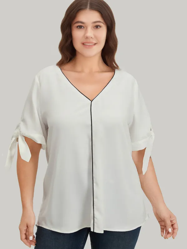 Contrast Trim Knot High Low Hem Blouse sold by Bloomchic