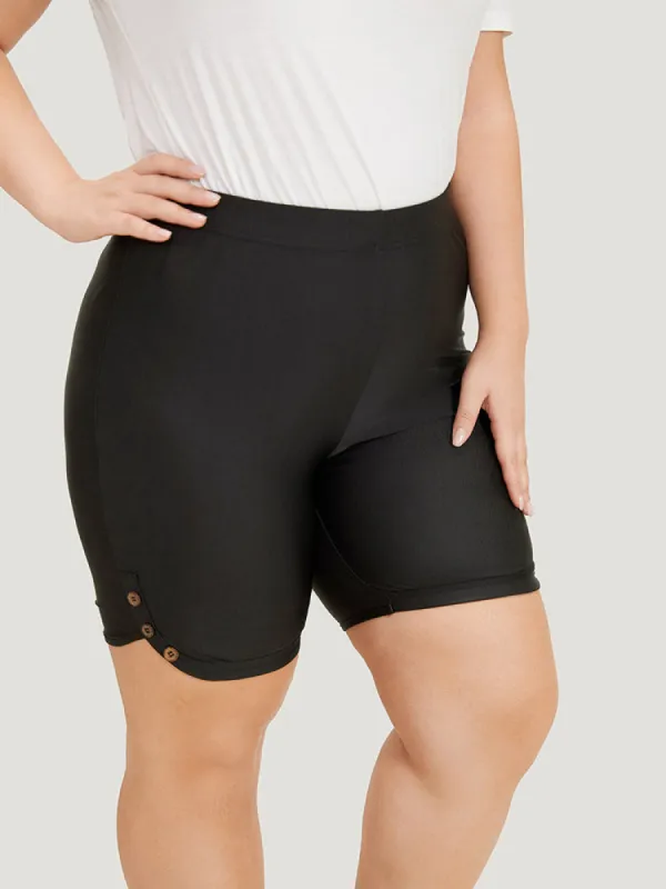 Plain Button Detail Dolphin Hem Leggings sold by Bloomchic