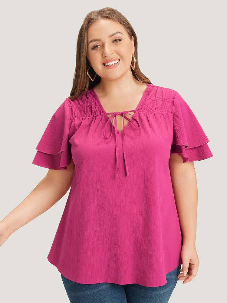 Solid Tie Neck Shirred Flutter Layered Sleeve Blouse sold by Bloomchic product image thumbnail 2