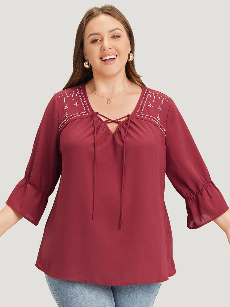 Plain Embroidered Lace Up Bell Sleeve Blouse sold by Bloomchic