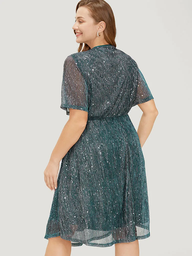 Glitter Mesh Flutter Sleeve Pocket Wrap Dress sold by Bloomchic product image thumbnail 2