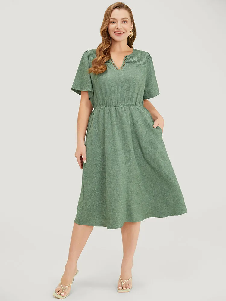 Solid Pleated Detail Lace Pocket Ruffle Sleeve Dress sold by Bloomchic