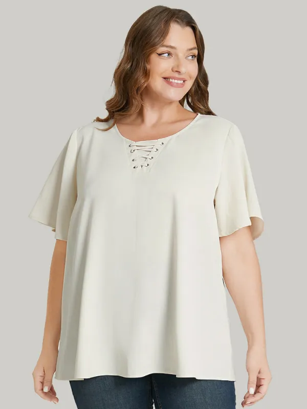Solid Ruffle Sleeve Crisscross Neck Blouse sold by Bloomchic