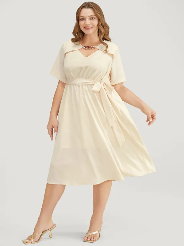 Solid Chain Detail Cut Out Pocket Belted Flutter Dress sold by Bloomchic