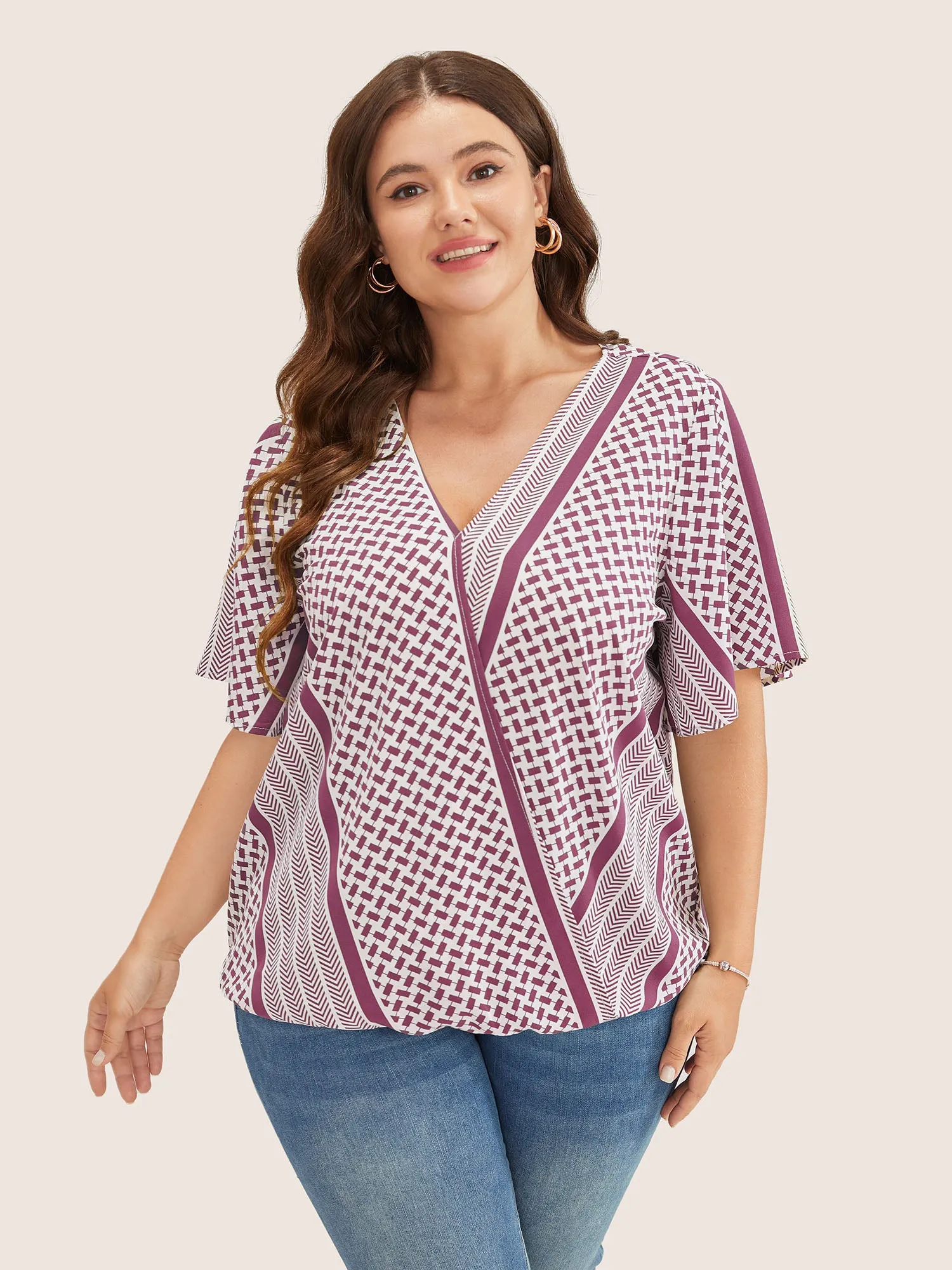 Geometric Contrast Ruffle Sleeve Wrap Blouse sold by Bloomchic