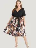 Graphic Print Pocket Ruffle Surplice Neck Belt Dress sold by Bloomchic