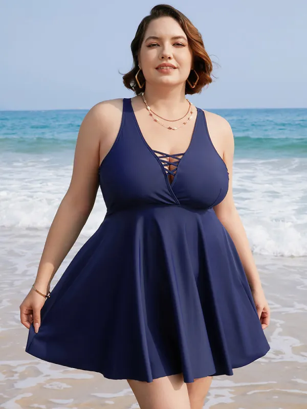 Crisscross Neck Adjustable Straps Ruffles Hem Swim Dress sold by Bloomchic