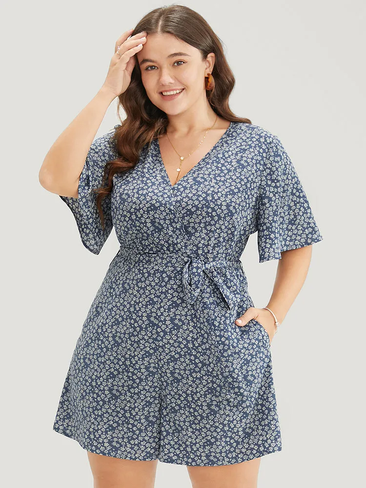 Ditsy Floral Ruffle Wrap Pocket Belted Romper sold by Bloomchic