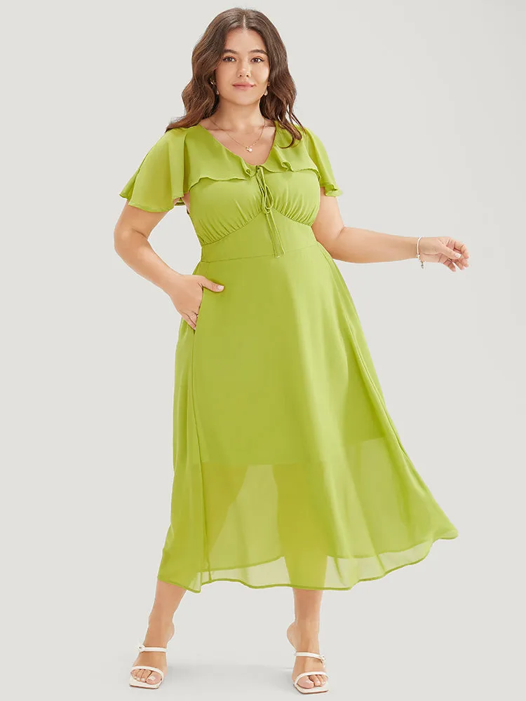 Solid Ruffle Trim Pocket Empire Waist Knot Cape Detail Dress sold by Bloomchic