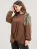 Leopard Patchwork Lantern Sleeve Twist Front Sweatshirt sold by Bloomchic