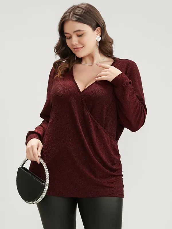 Solid Glitter Surplice Neck Blouse sold by Bloomchic