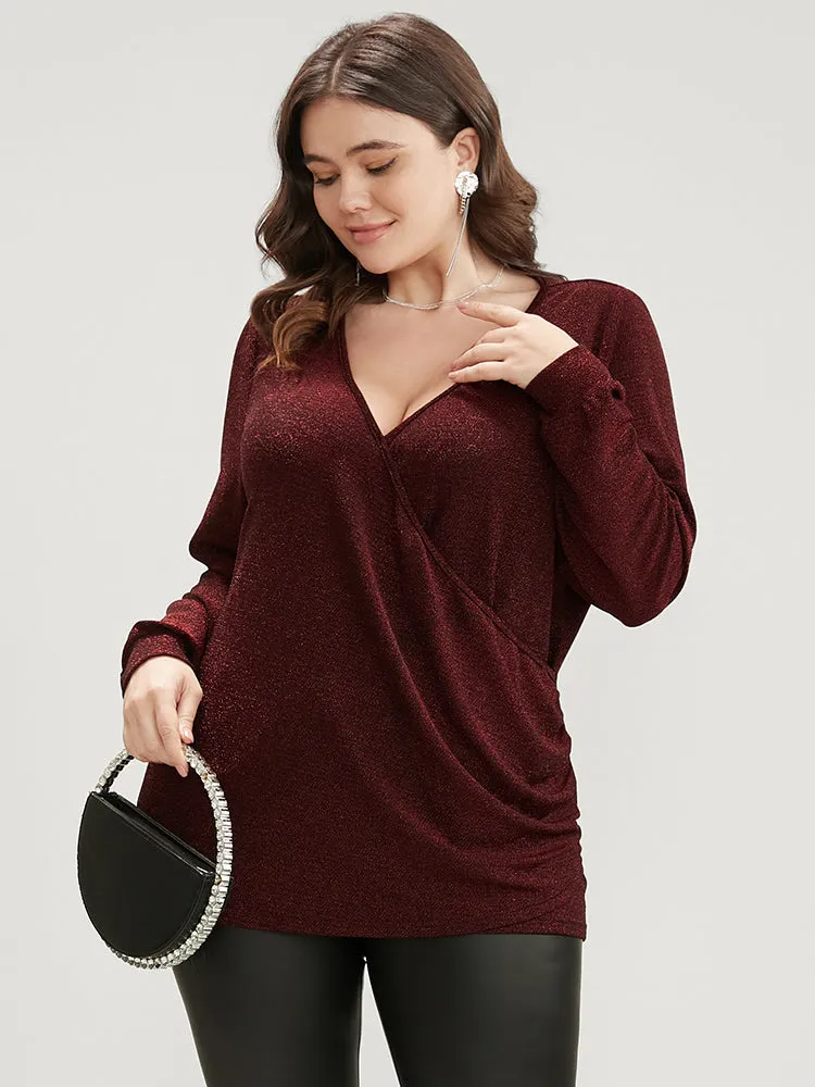 Solid Glitter Surplice Neck Blouse sold by Bloomchic