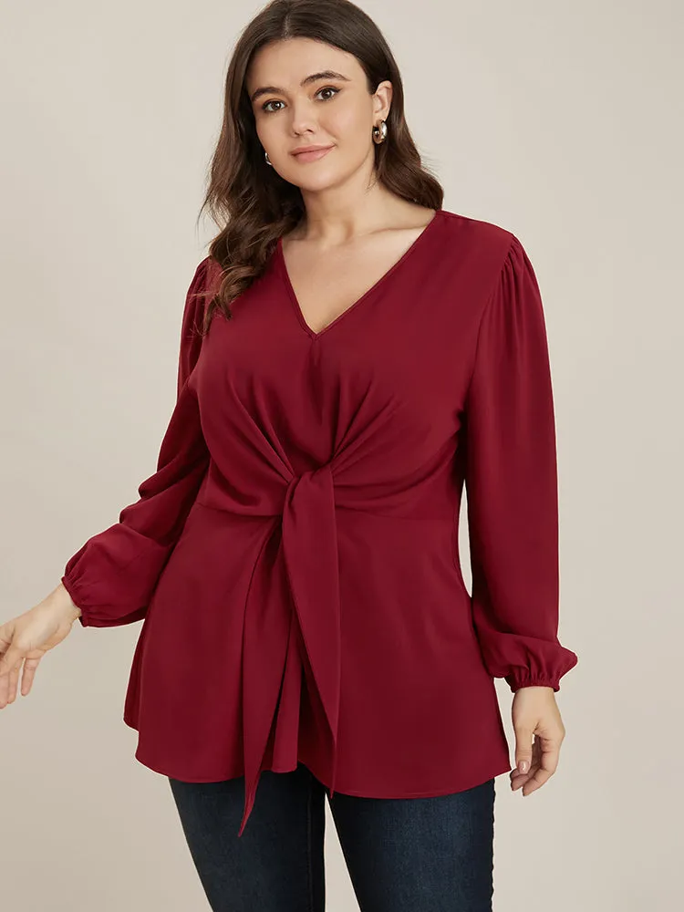 Solid V Neck Lantern Sleeve Knotted Front Blouse sold by Bloomchic product image thumbnail 2