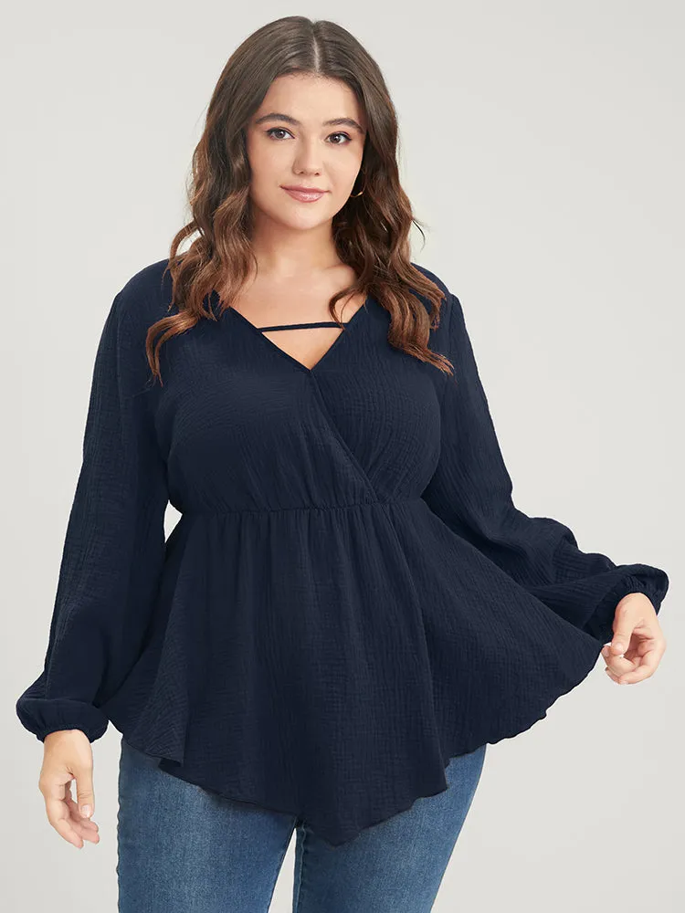 Solid Lantern Sleeve Asymmetrical Hem Wrap Blouse sold by Bloomchic