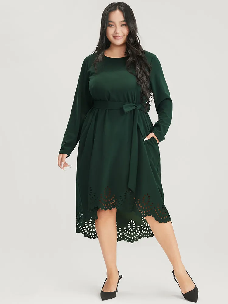 Solid Pocket Laser Cut Asymmetrical Hem Belted Dress sold by Bloomchic