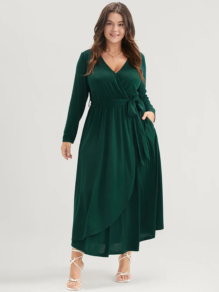 Solid Wrap Pocket Belted Asymmetrical Hem Dress sold by Bloomchic