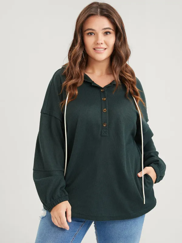 Solid Pocket Button Drawstring Waffle Knit Hooded Sweatshirt sold by Bloomchic