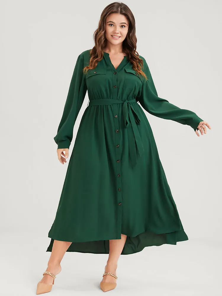 Solid V Neck Pocket Button Asymmetrical Flutter Hem Belted Dress sold by Bloomchic