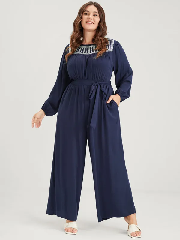 Solid Pocket Lantern Sleeve Embroidered Belted Jumpsuit sold by Bloomchic