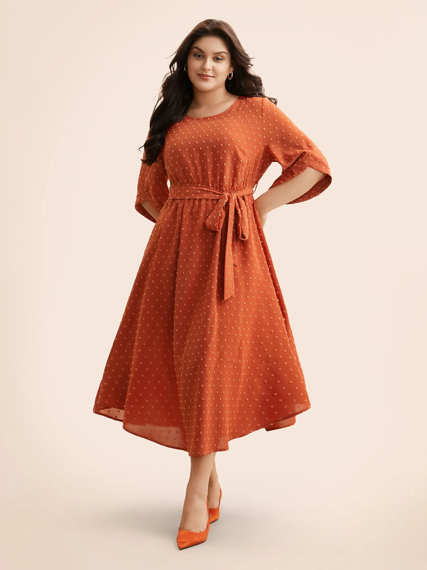 Textured Bell Sleeve Belted Arc Hem Dress sold by Bloomchic