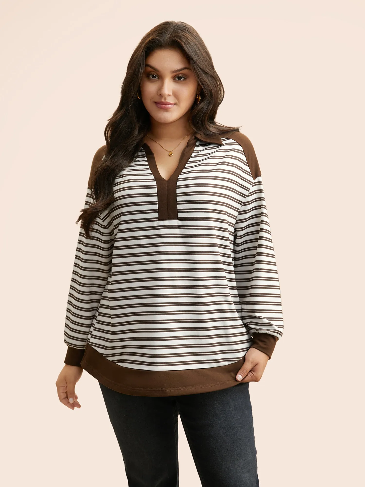 Striped Patchwork Arc Hem Sweatshirt sold by Bloomchic