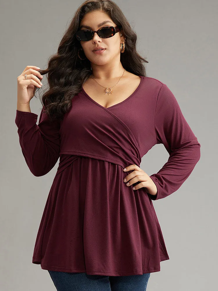 Solid Crossover V Neck Ruffle Hem T-shirt sold by Bloomchic