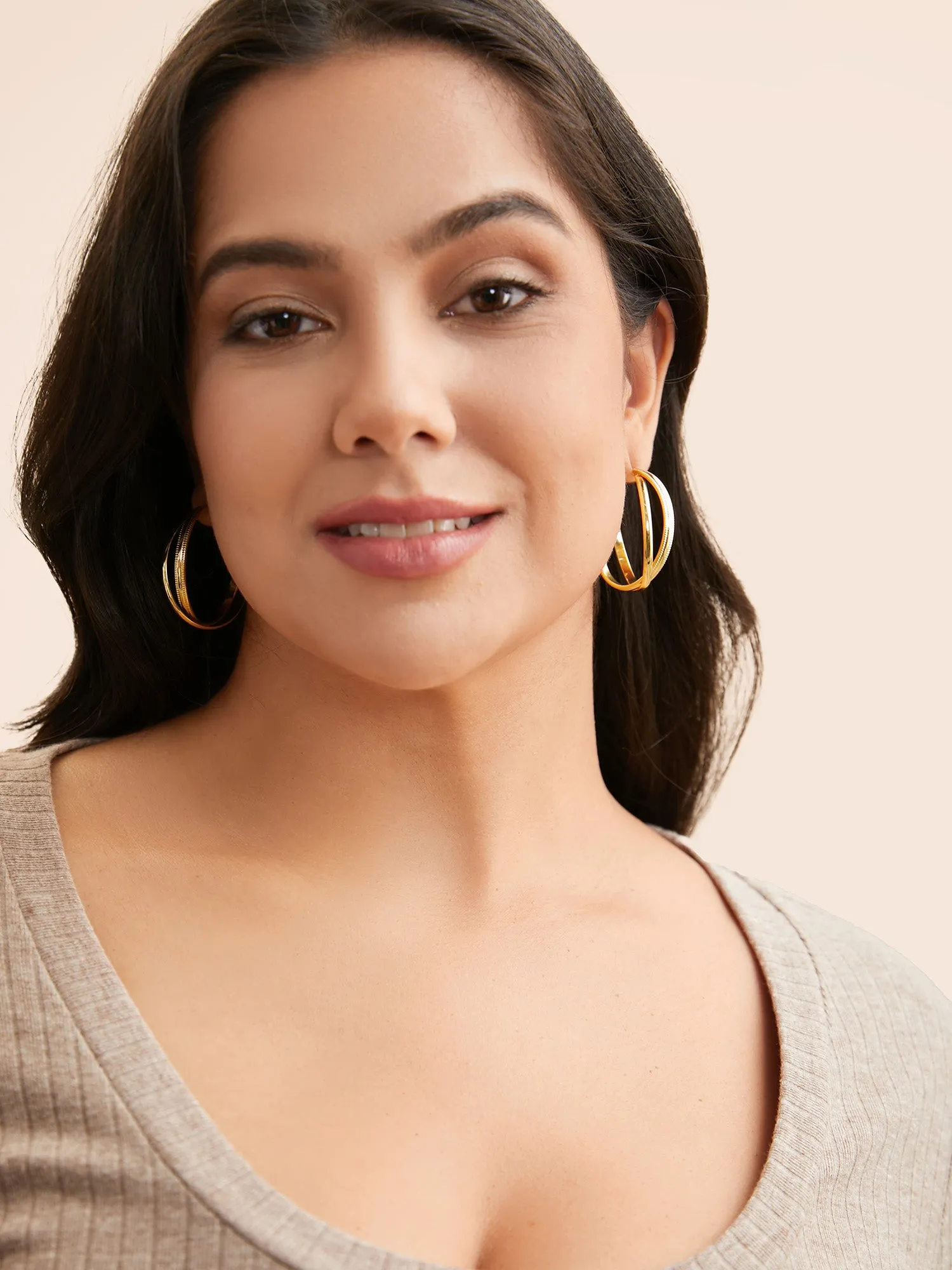 Twisted Gold Hoop Earrings sold by Bloomchic