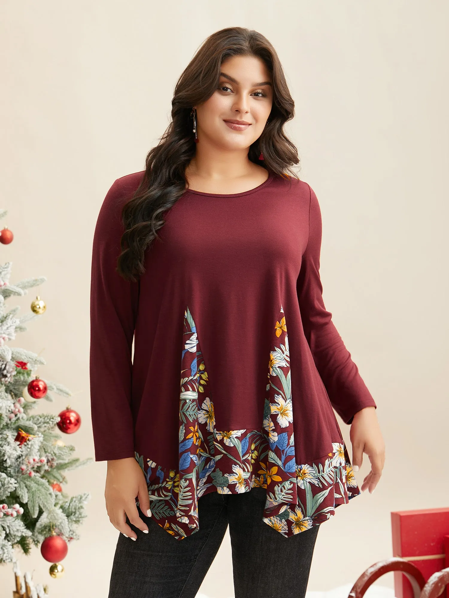 Holiday Printed Asymmetrical Hem Jersey Top sold by Bloomchic