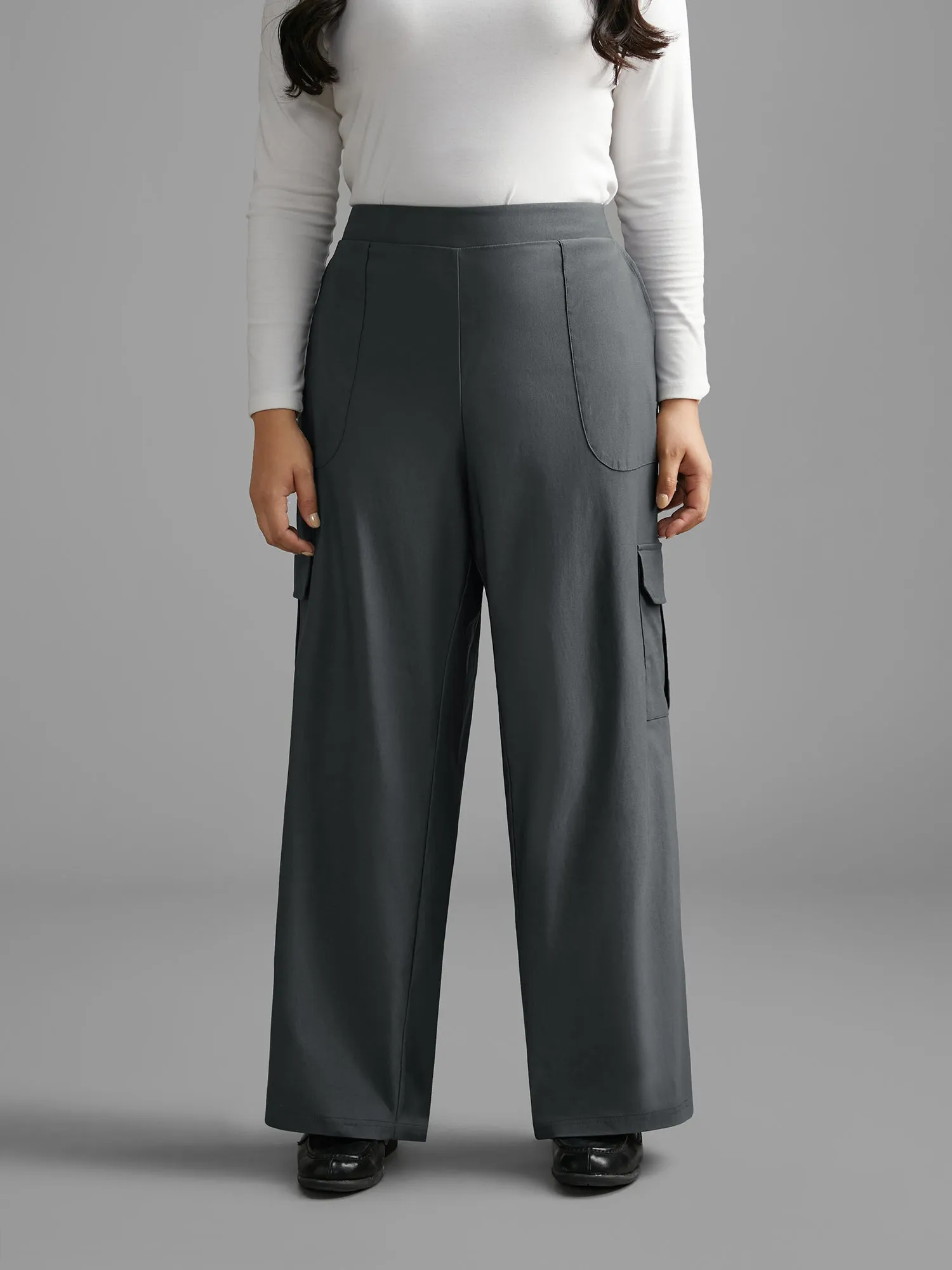 Solid Elastic Waist Patched Pocket Pants sold by Bloomchic