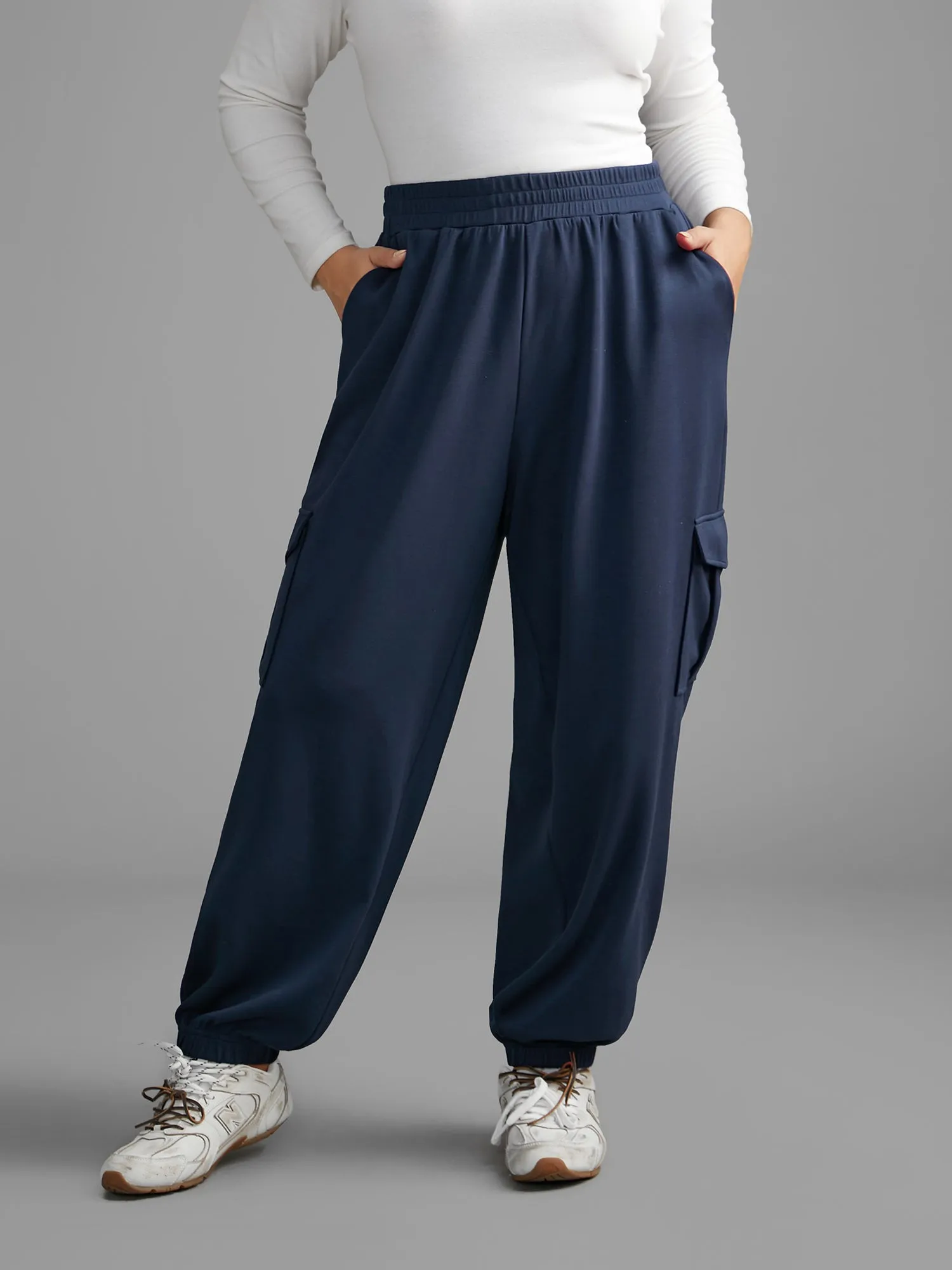 Mid Rise Patched Pocket Carrot Pants sold by Bloomchic