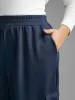 Mid Rise Patched Pocket Carrot Pants sold by Bloomchic