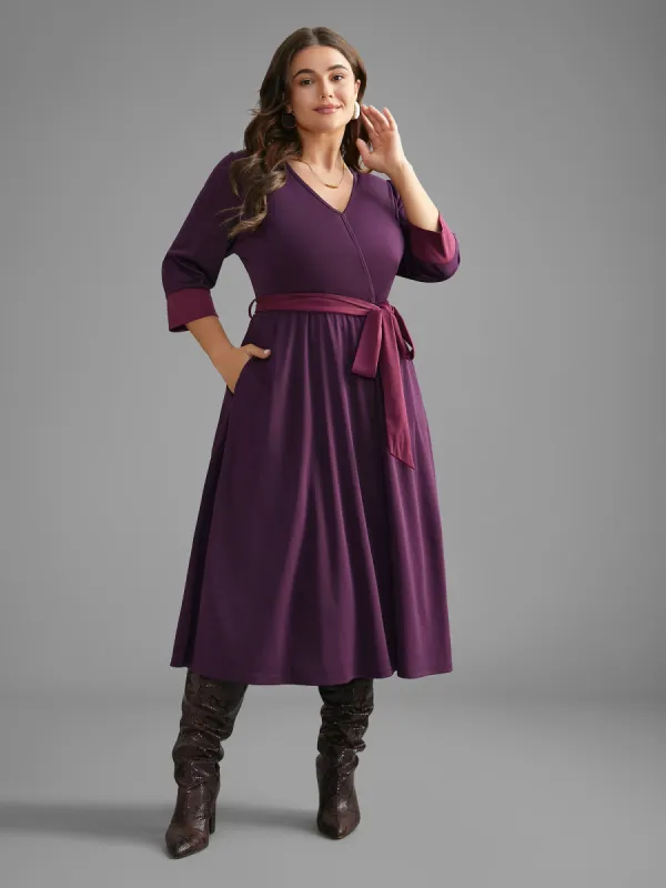 Overlap Collar Contrast Belted Midi Dress sold by Bloomchic