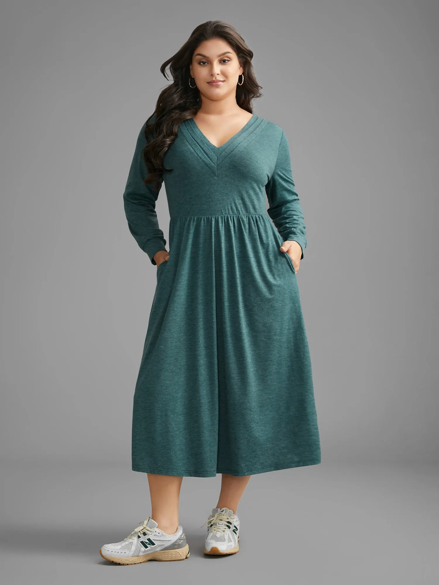 Solid V Neck Pleated Knit Dress sold by Bloomchic