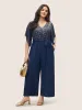 Glitter Overlap Collar Mesh Flutter Sleeve Jumpsuit sold by Bloomchic