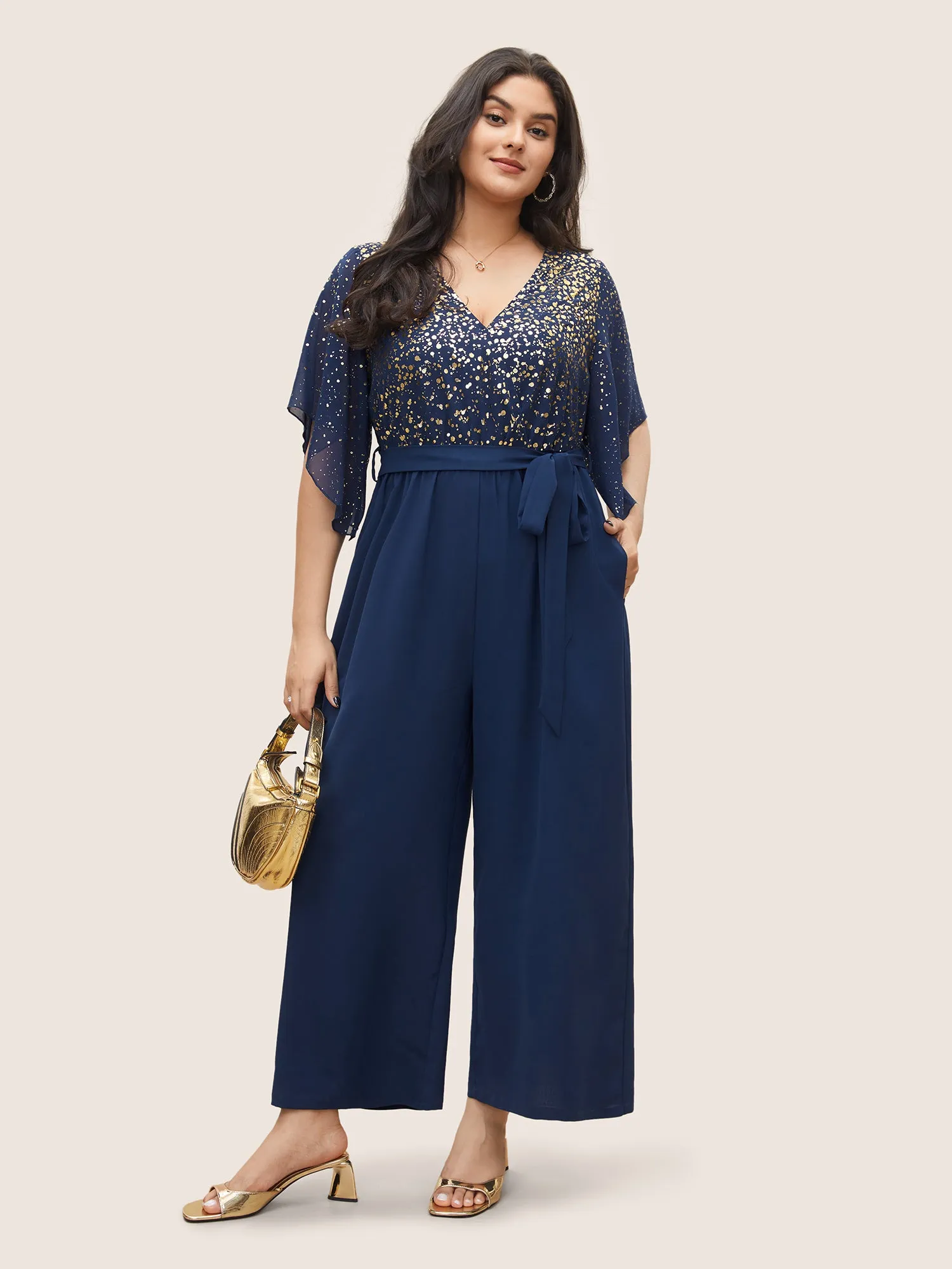 Glitter Overlap Collar Mesh Flutter Sleeve Jumpsuit sold by Bloomchic