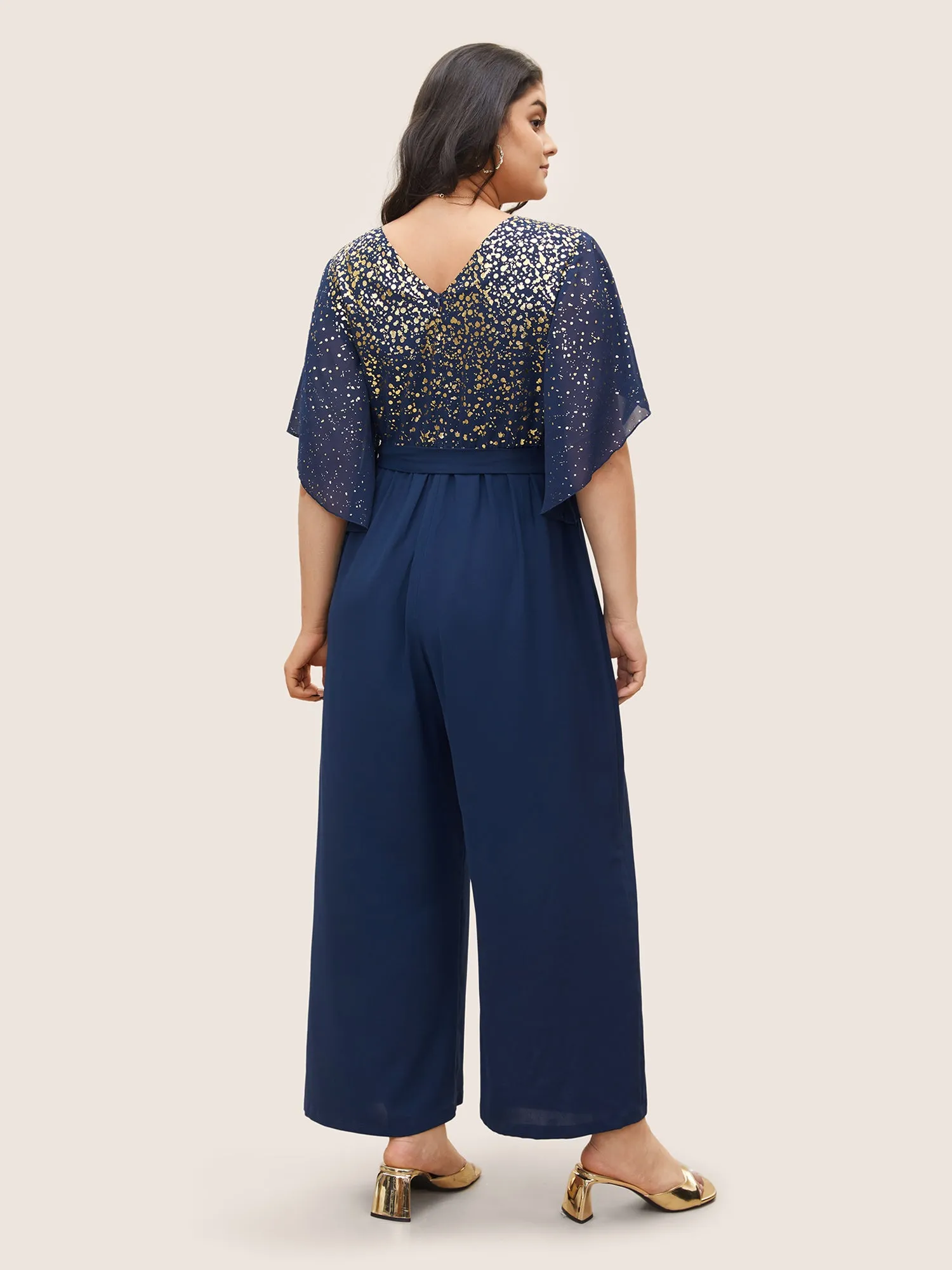 Glitter Overlap Collar Mesh Flutter Sleeve Jumpsuit sold by Bloomchic product image thumbnail 3