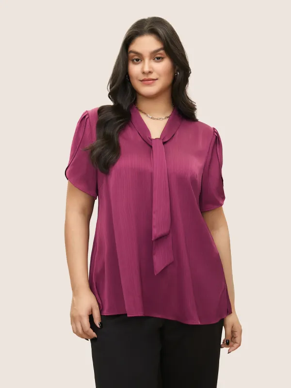 Solid Textured Tie Neck Petal Sleeve Blouse sold by Bloomchic